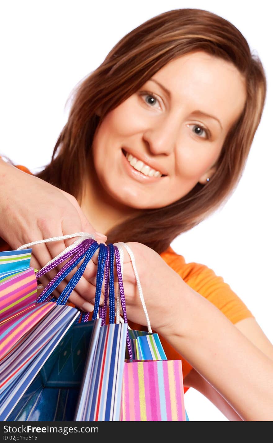 Shopping woman smiling. Isolated over white background