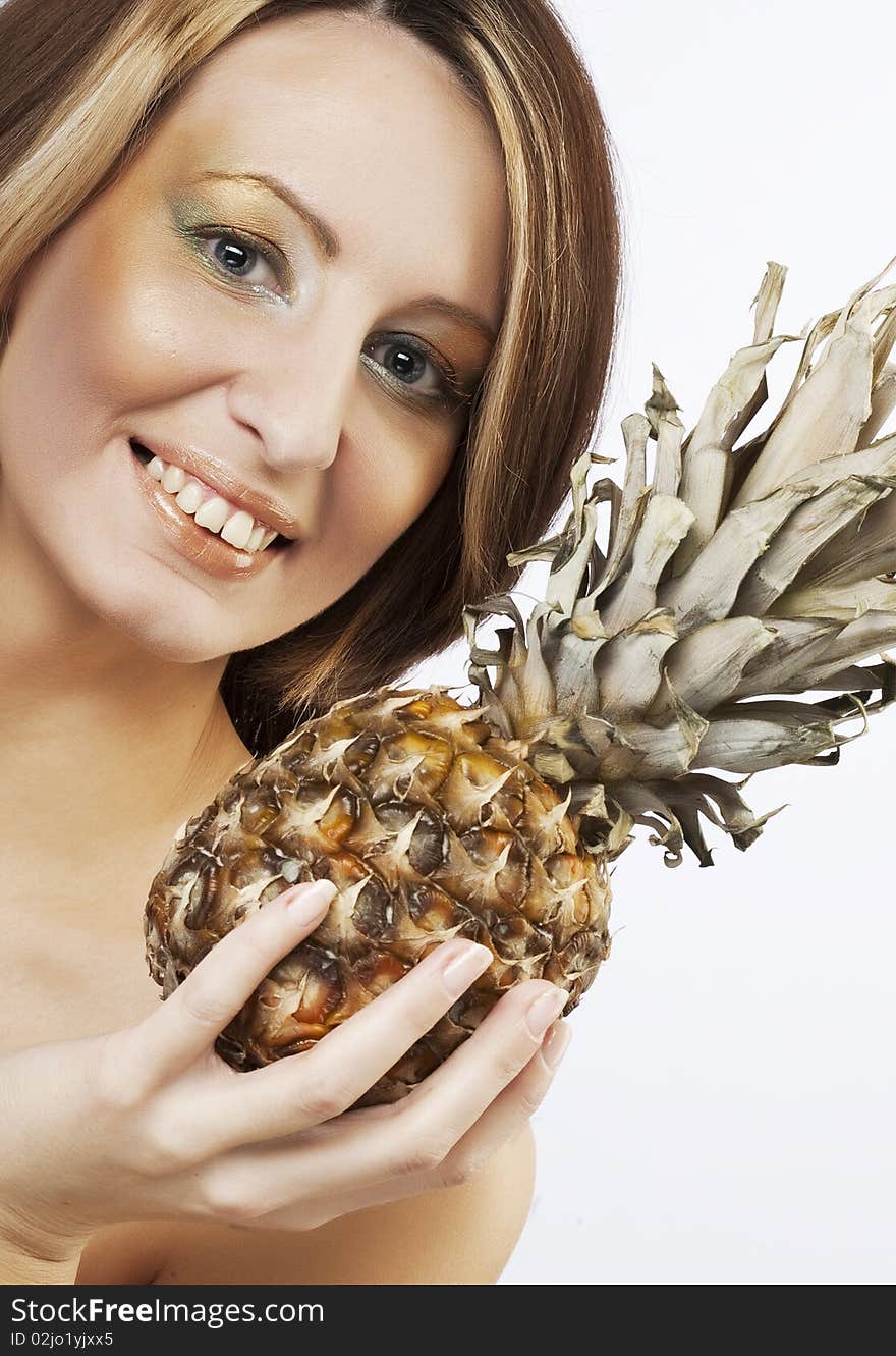 Young lovely woman  with pineapple