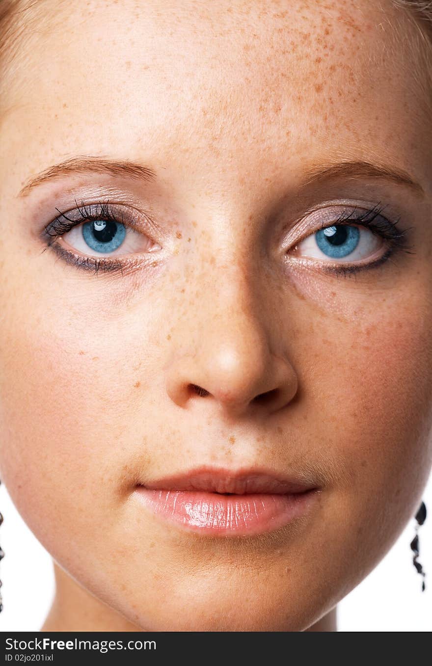 Close-up portrait of a beautiful young blue-eyed model. Close-up portrait of a beautiful young blue-eyed model.