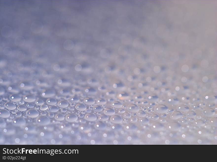 Small water drops background macro shot (shallow depth of field)