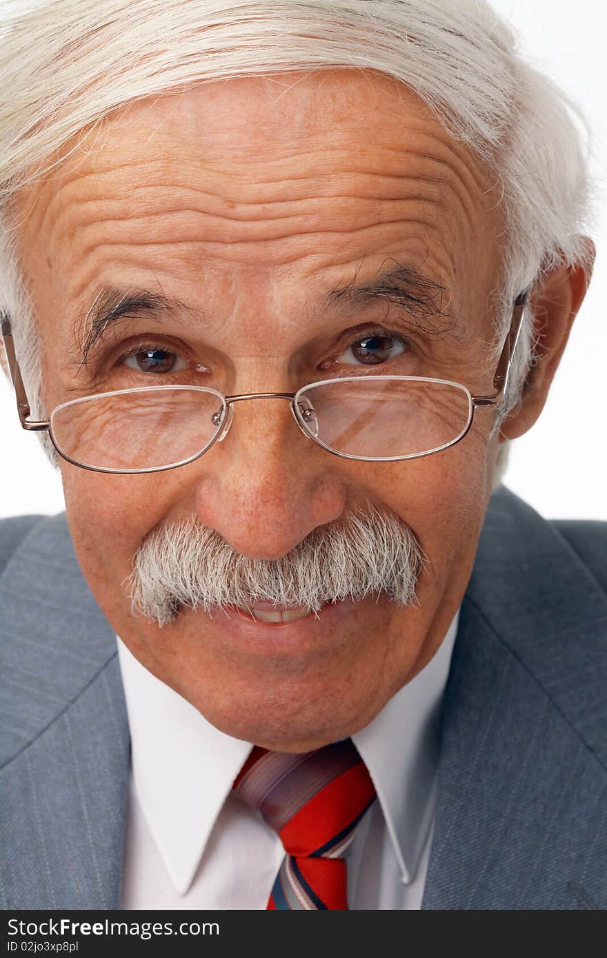 Close-up portrait of a happy elder businessman in the glasses. Close-up portrait of a happy elder businessman in the glasses.