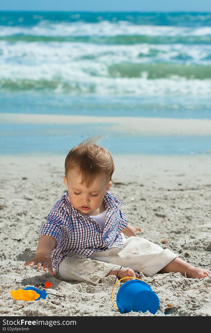 Child playing on a beach. Child playing on a beach