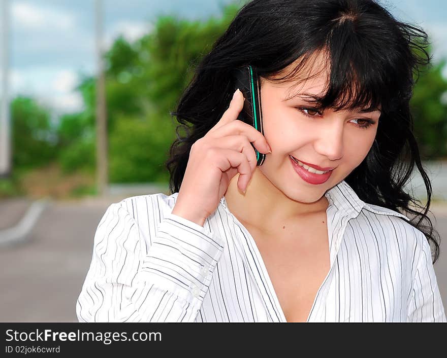 Young business woman talking on mobile phone