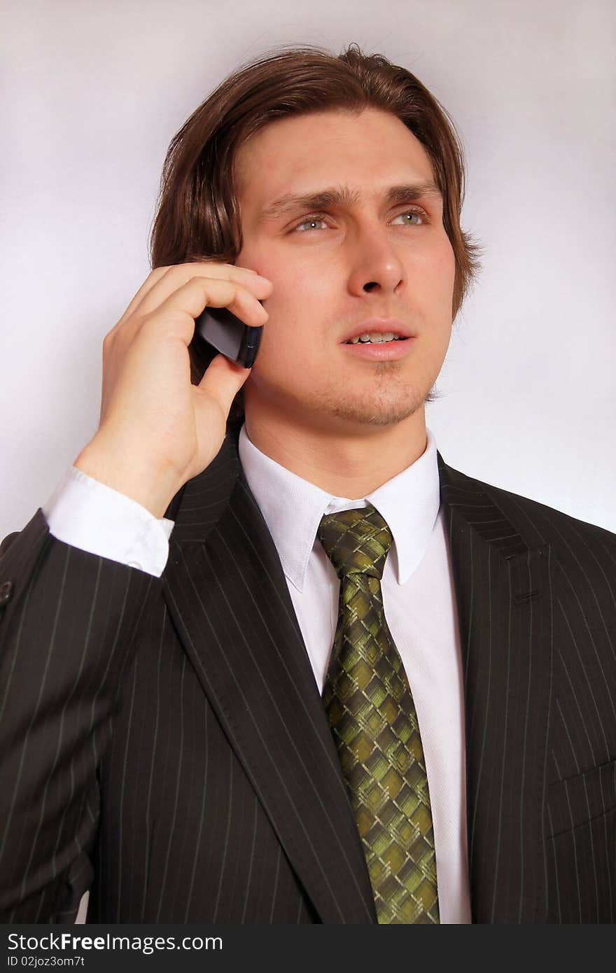 Young businessman with phone