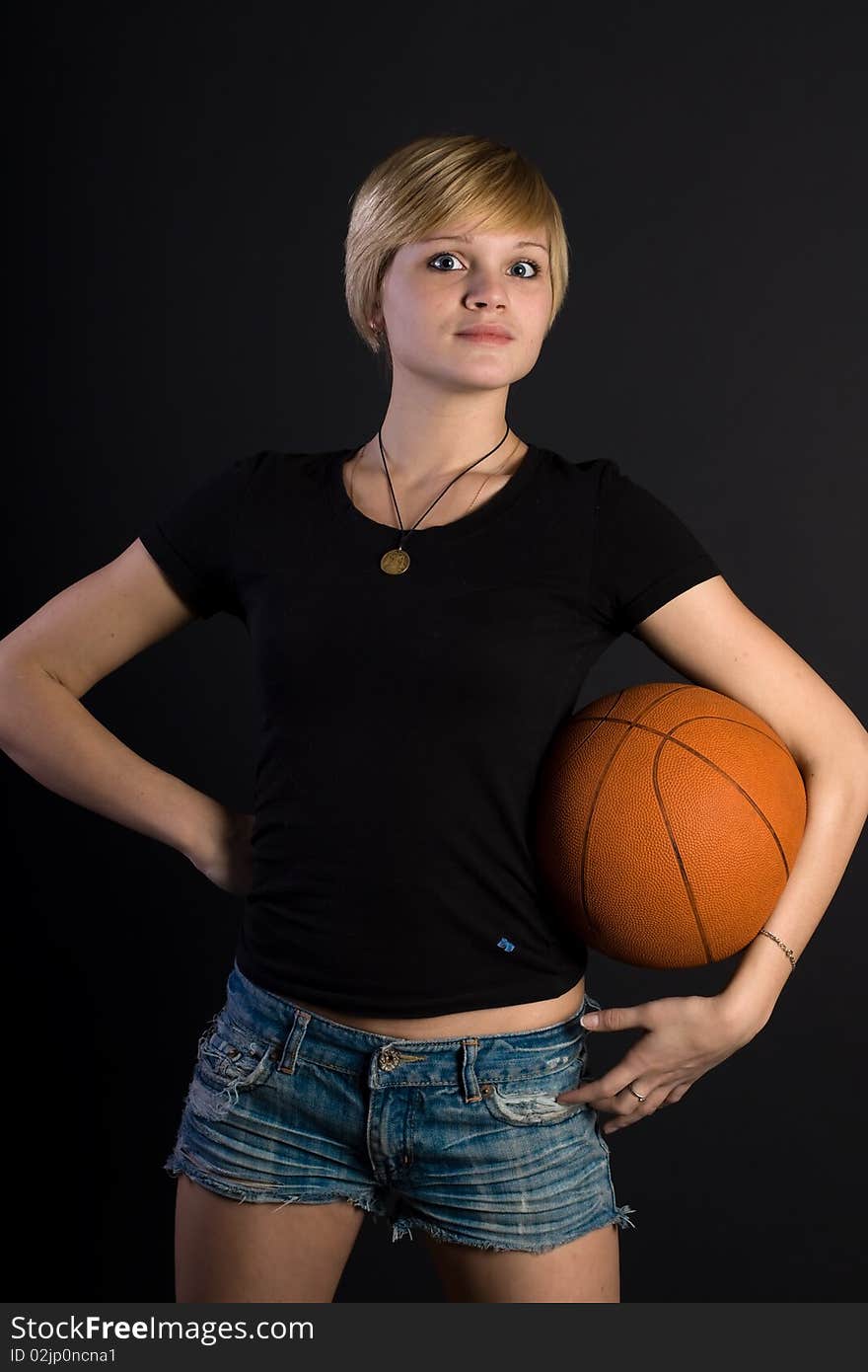 Beautiful girl holding a red ball. Beautiful girl holding a red ball