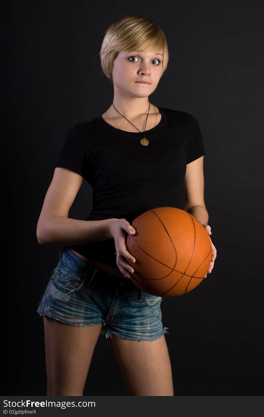 Beautiful girl holding a red ball. Beautiful girl holding a red ball