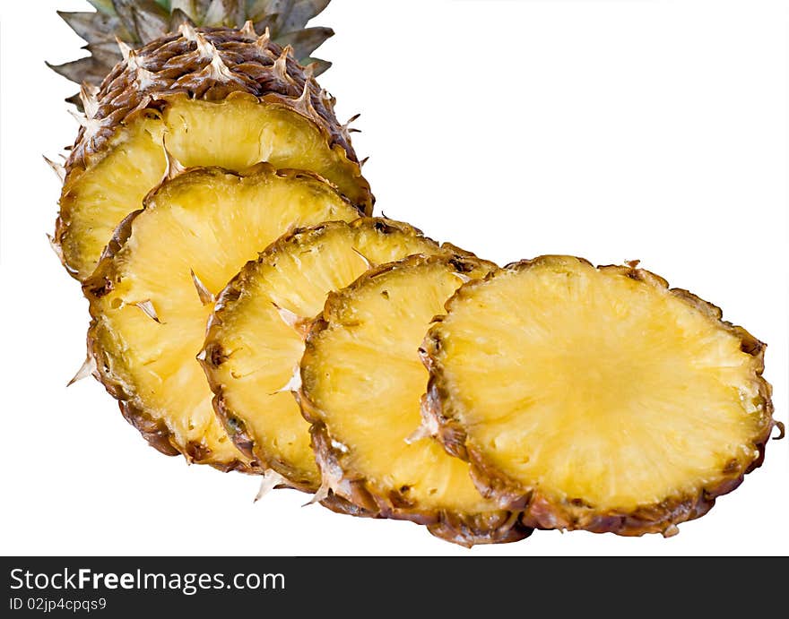 Tasty and ripe pineapple slices over the white bac