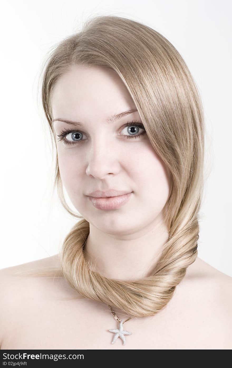 Closeup portrait of attractive young woman. Clean skin