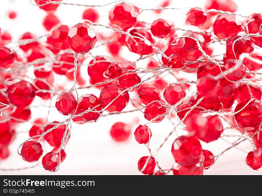 A chain  with red jewels isolated on white. A chain  with red jewels isolated on white