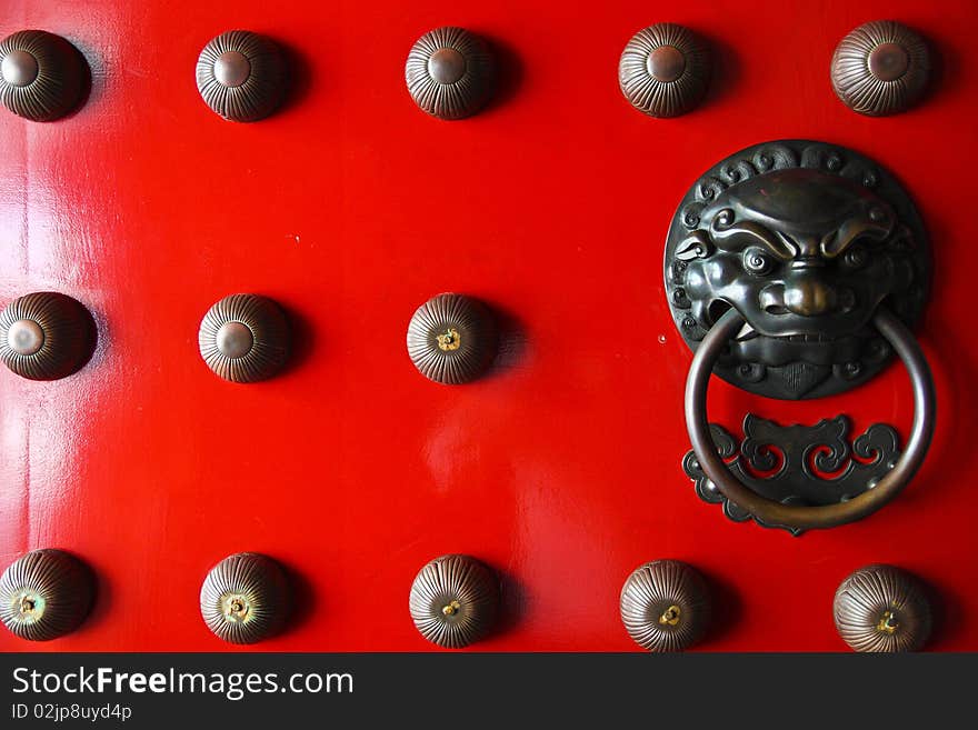 Asian door knocker with lion engraving