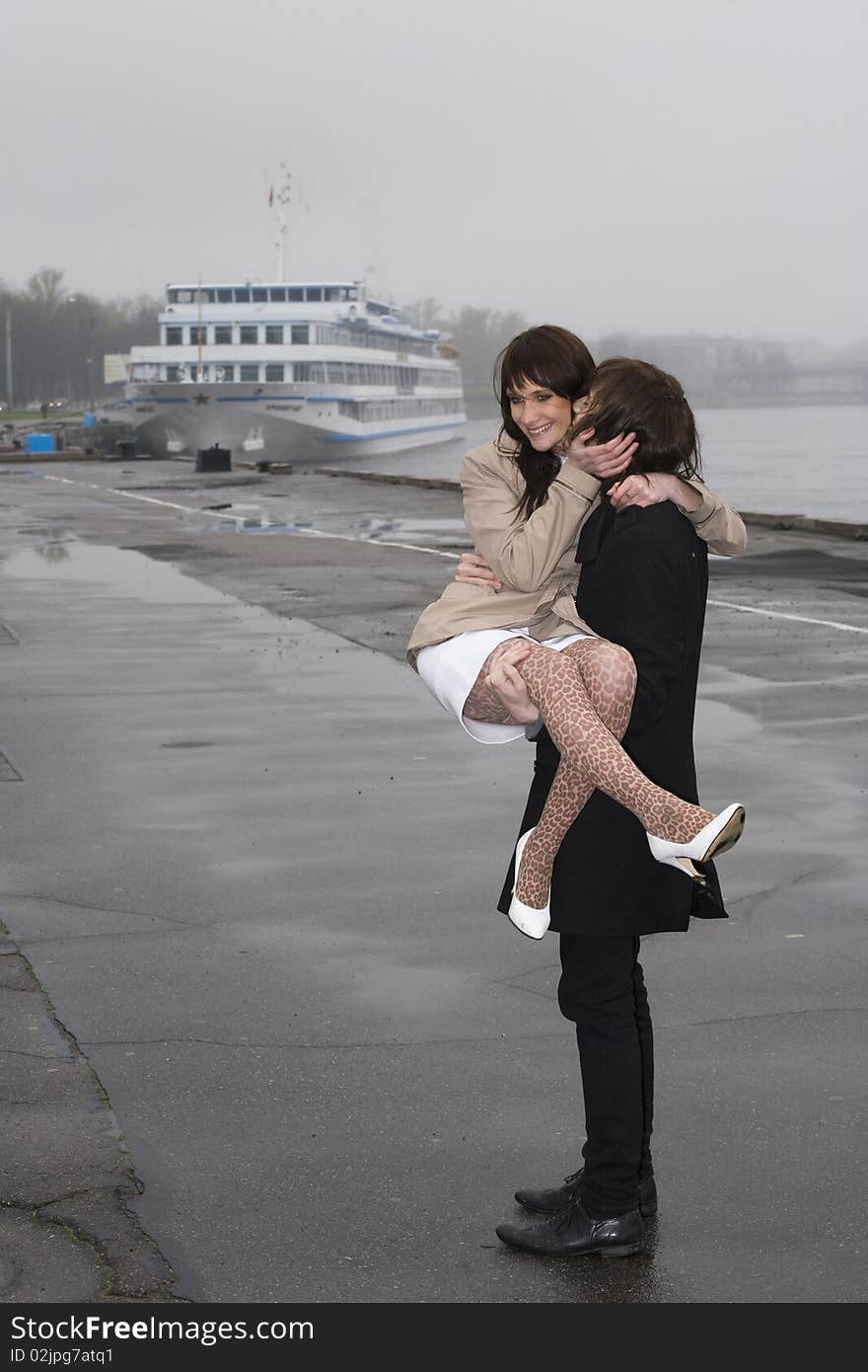 Young couple under rain