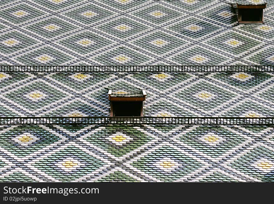 Roof pattern of the main church of Bolzano, beautiful city located in the region of Alto Adige (Italy)