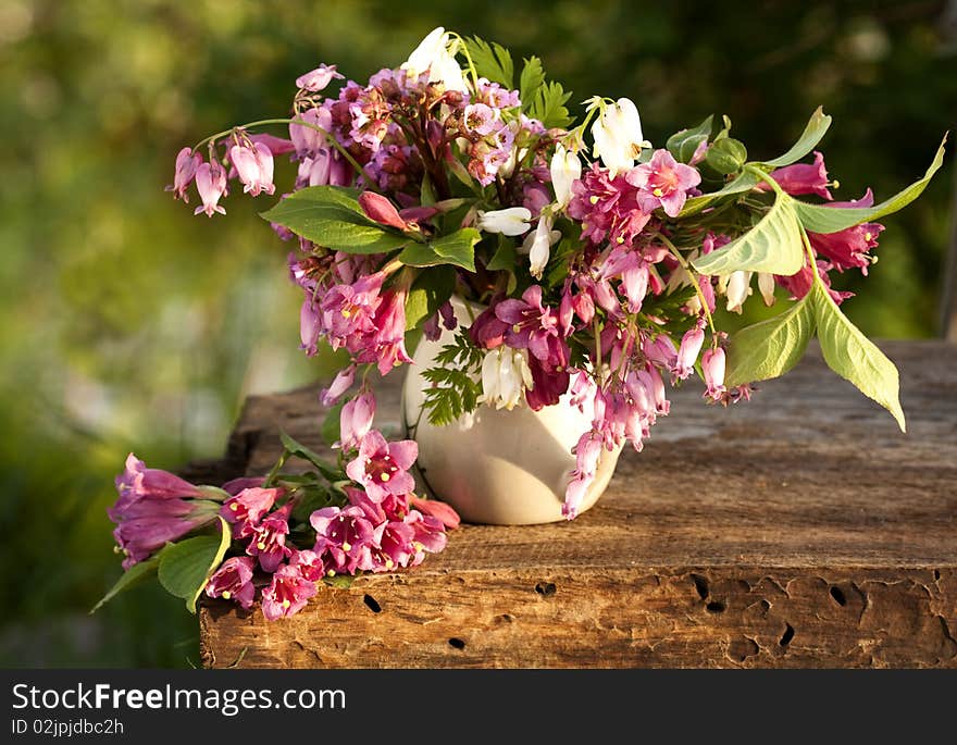 Bouquet of pink flowers at sunset