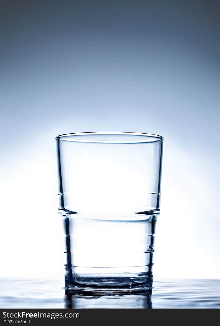 Simple Glass Standing On Water.