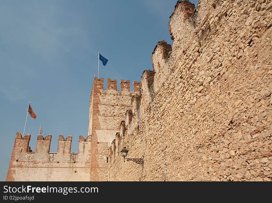 Castle wall in italy on blue sky