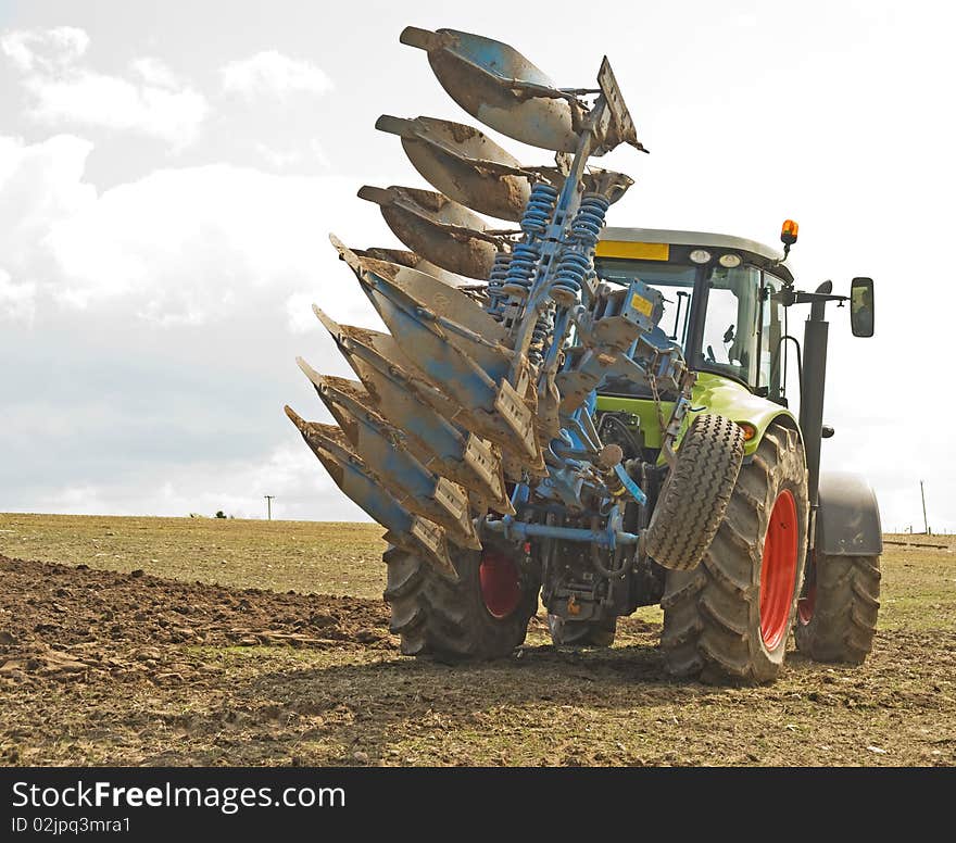 Tractor Turning With A Raised Plow.