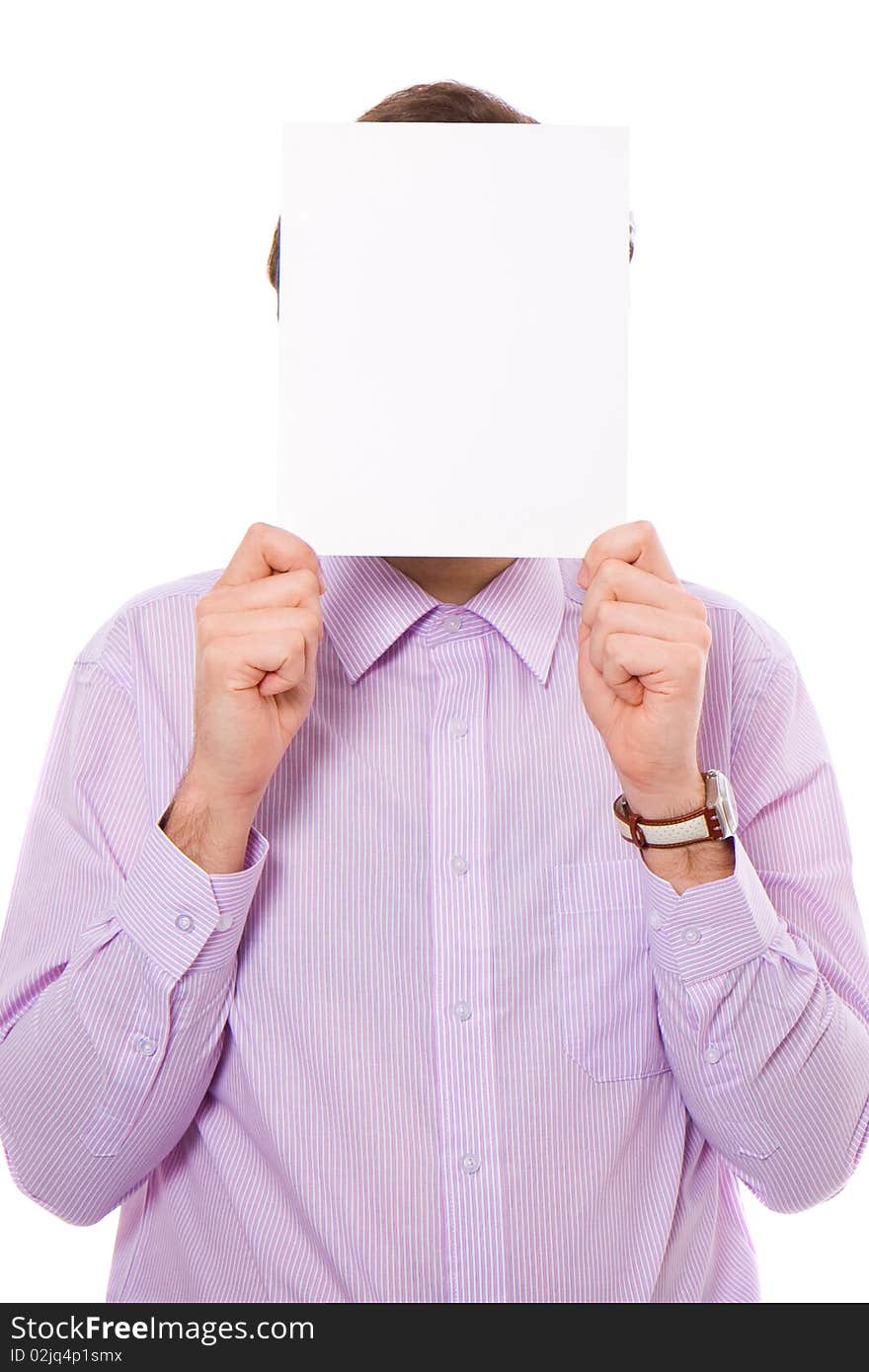 Young male adult holds a4 size copyspace in front of his face, isolated on white. Young male adult holds a4 size copyspace in front of his face, isolated on white