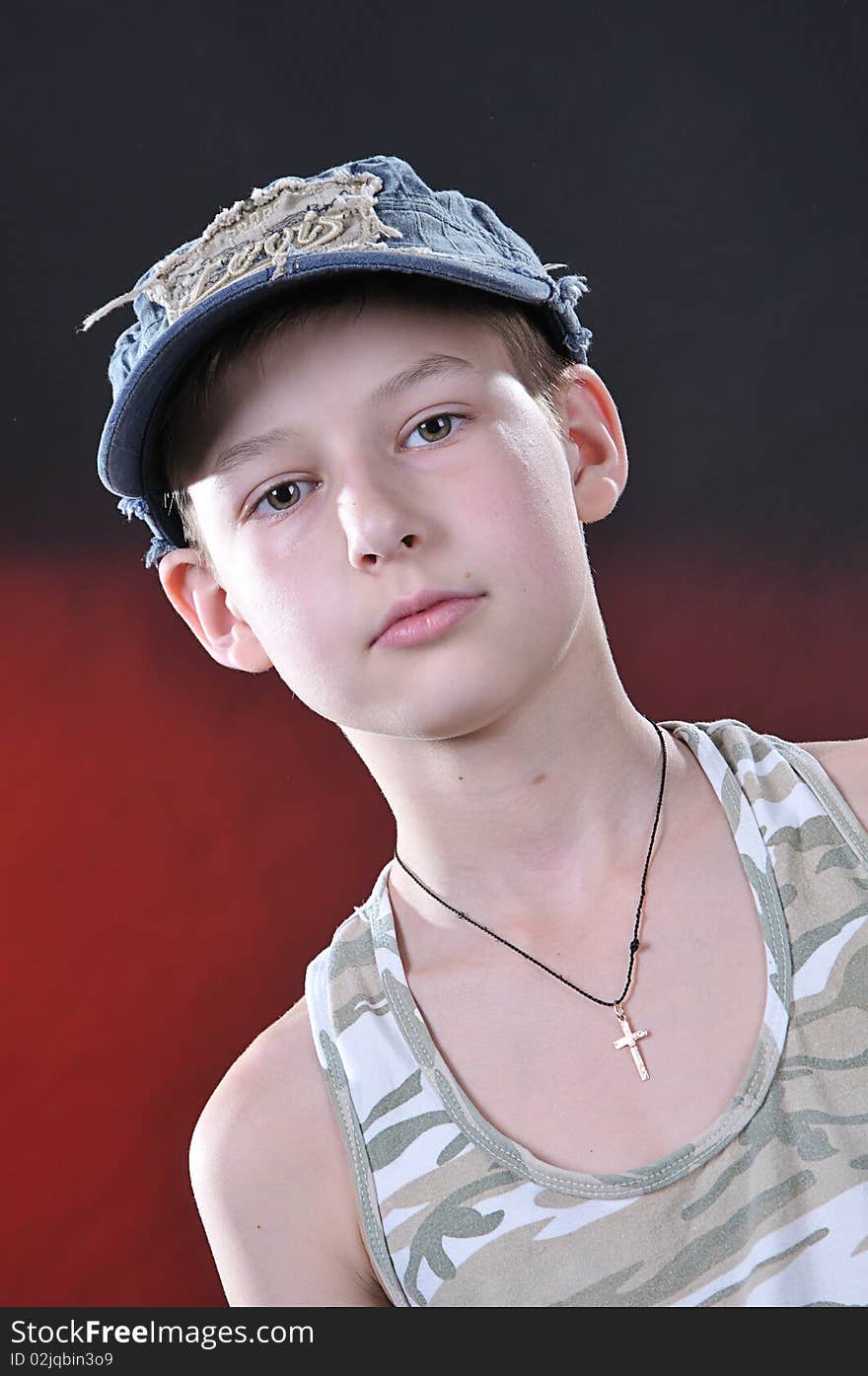 Portrait of is ten years old boy in a jean cap