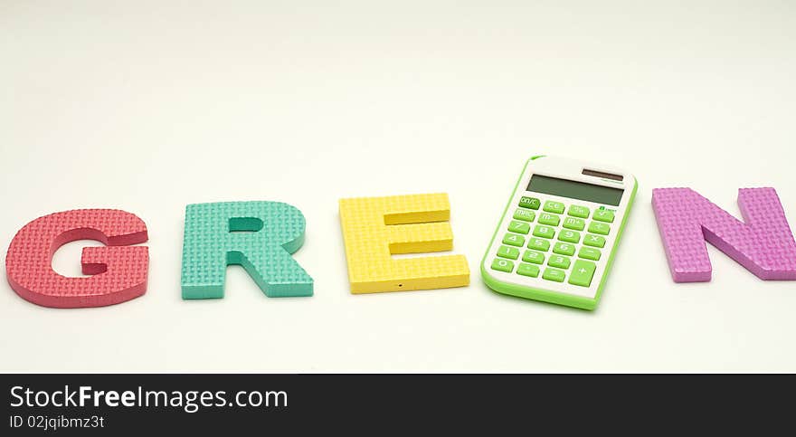 A green calculator in green alphabet with white background