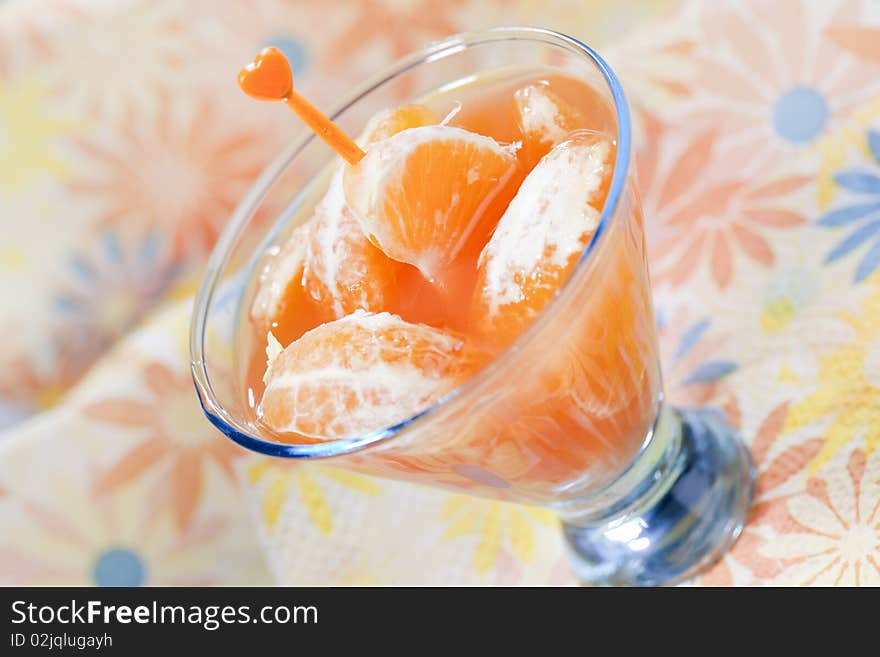 Tangerine cocktails with pieces of fruit