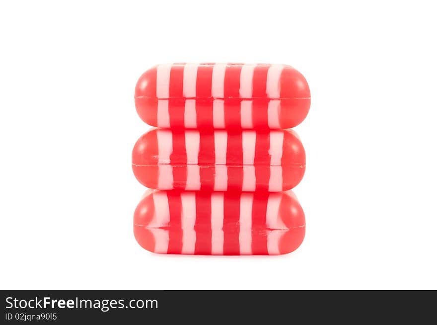 The stack of striped soaps isolated on white