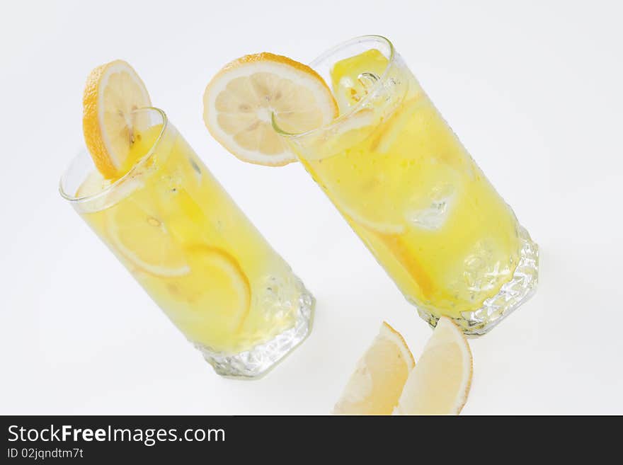 Cold lemon cocktails on white background