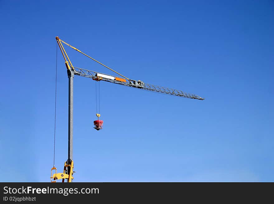 Construction crane on havy blue sky. Construction crane on havy blue sky.