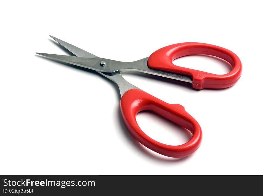 Red scissors isolated on white background