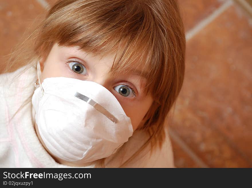 Little girl wearing a protective medical mask. Little girl wearing a protective medical mask