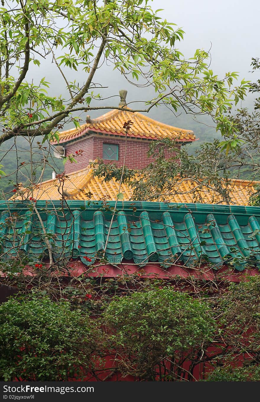 Multicolored Pagoda In Fog