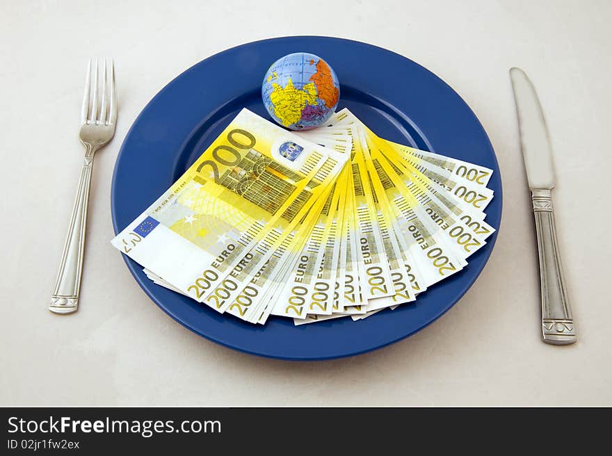 Euro money an small globe on the plate. Euro money an small globe on the plate