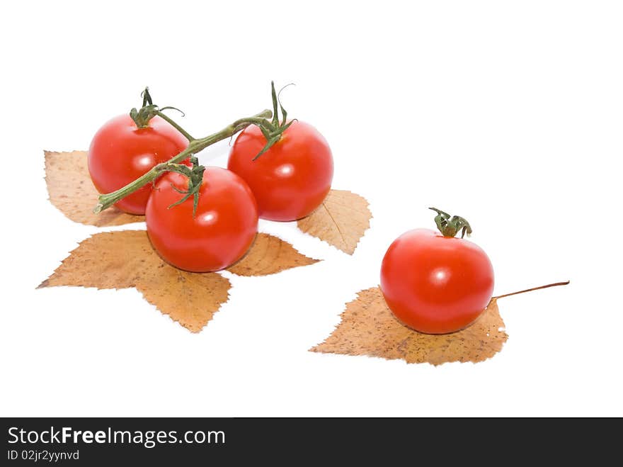 Red and fresh tomatoes on a white background. Red and fresh tomatoes on a white background