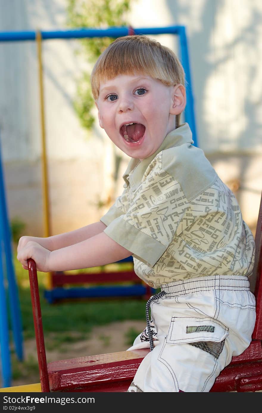 The little boy on walk in the summer. The little boy on walk in the summer