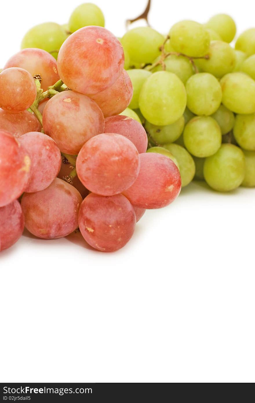 Red and green fresh grapes isolated