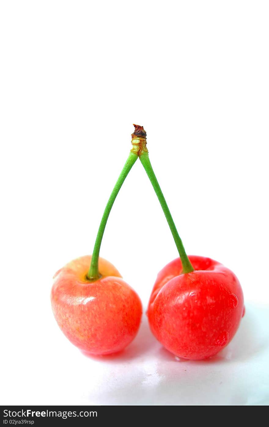 Fresh red cherry fruits isolated on a white background