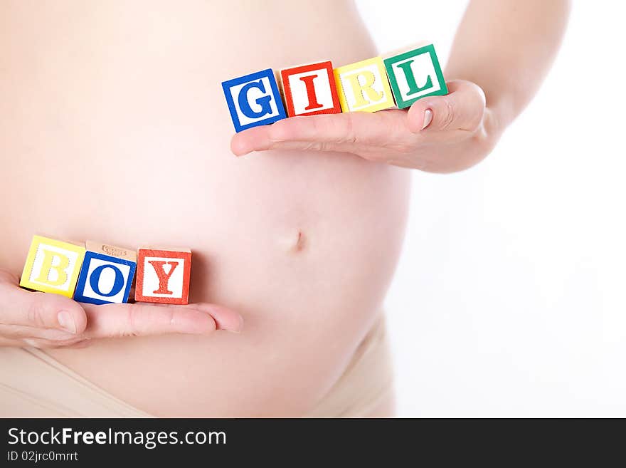 Pregnant belly with wooden toy blocks. Pregnant belly with wooden toy blocks