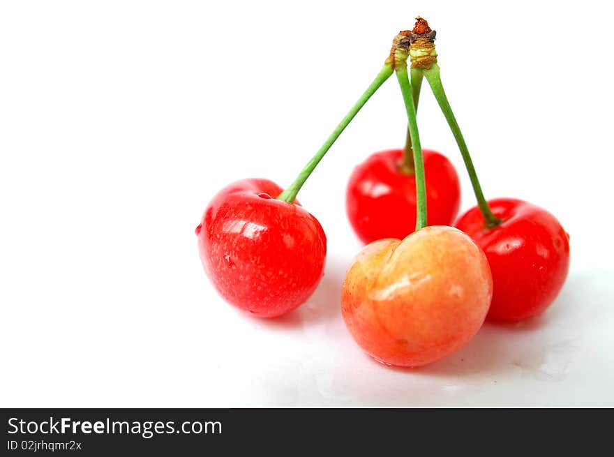 Fresh red cherry fruits isolated on a white background