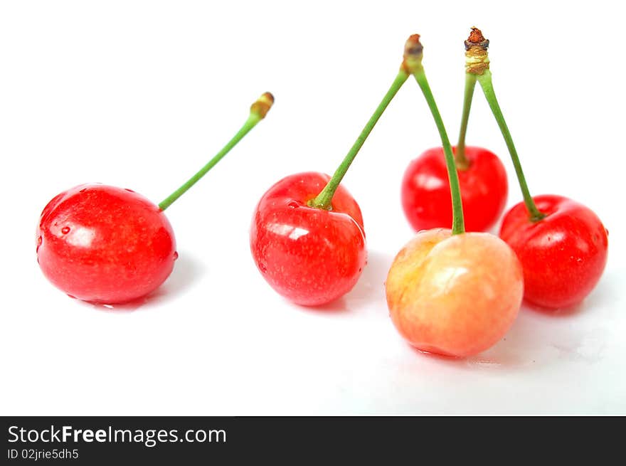 Fresh red cherry fruits isolated on a white background