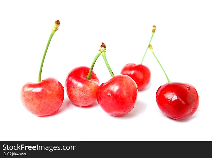 Fresh red cherry fruits isolated on a white background