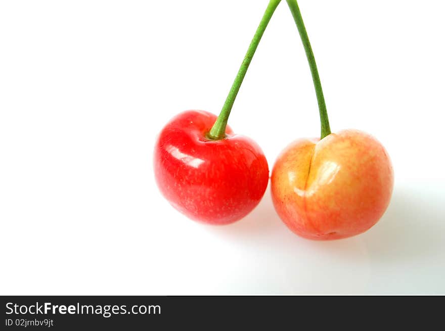 Fresh red cherry fruits isolated on a white background