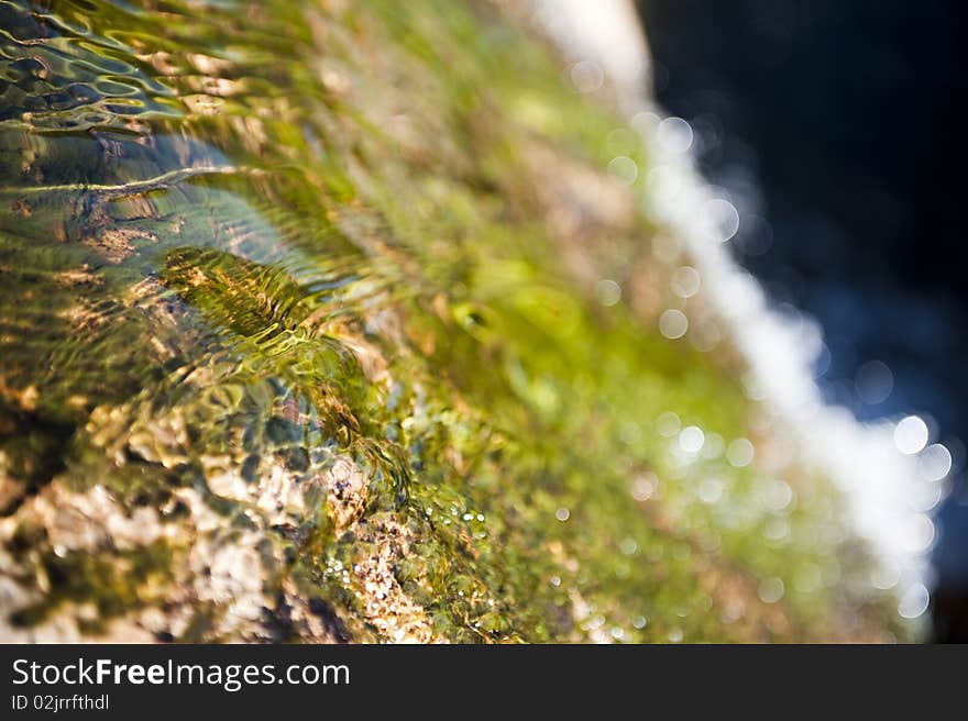 Water flowing on a rocky mountain. Water flowing on a rocky mountain