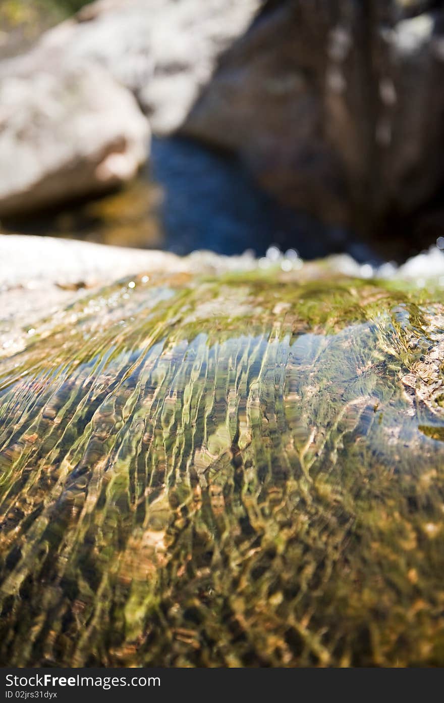 Water flowing on a rocky mountain. Water flowing on a rocky mountain