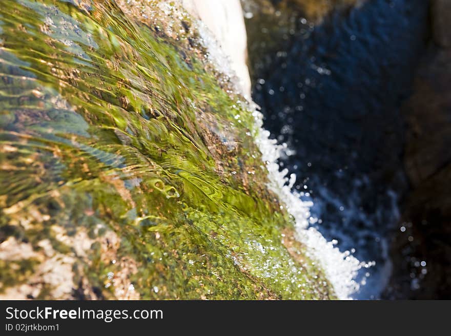 Water flowing on a rocky mountain. Water flowing on a rocky mountain