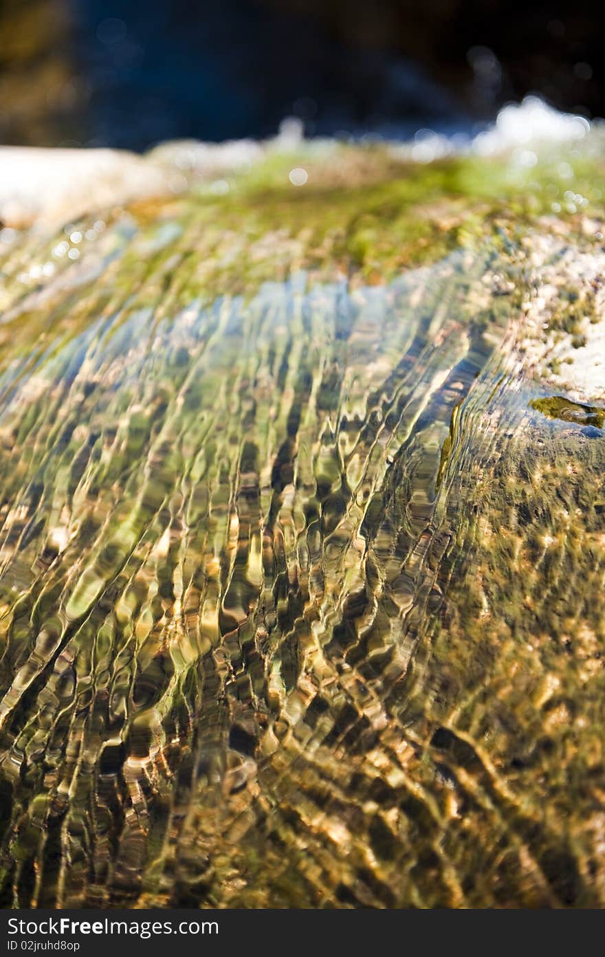 Water flowing on a rocky mountain. Water flowing on a rocky mountain