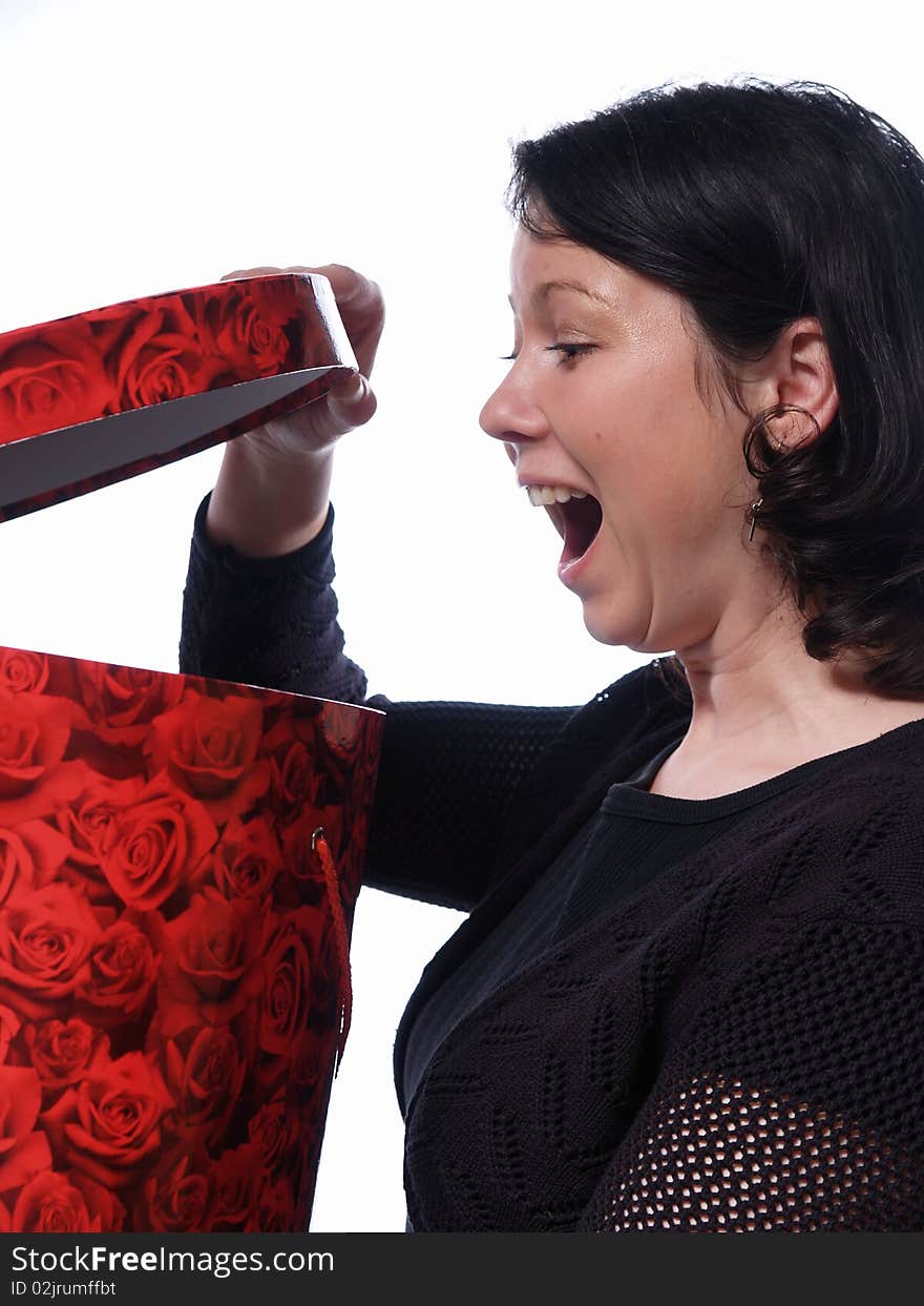 Surprised woman with red box in  hands oin white background