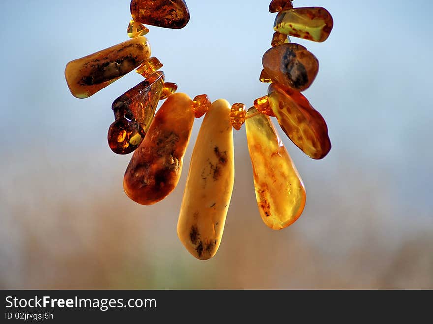 This shot was done outdoor using a sunflower and necklace of amber. This shot was done outdoor using a sunflower and necklace of amber