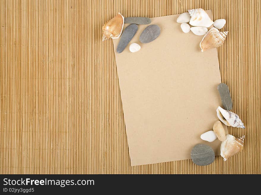 Against the backdrop of an old wooden surface paper with shells. Travel. Against the backdrop of an old wooden surface paper with shells. Travel