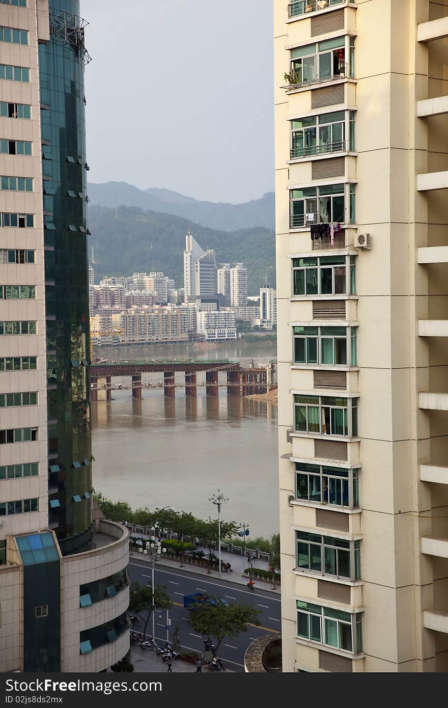 The modern buildings beside the river in Chinese city. The modern buildings beside the river in Chinese city