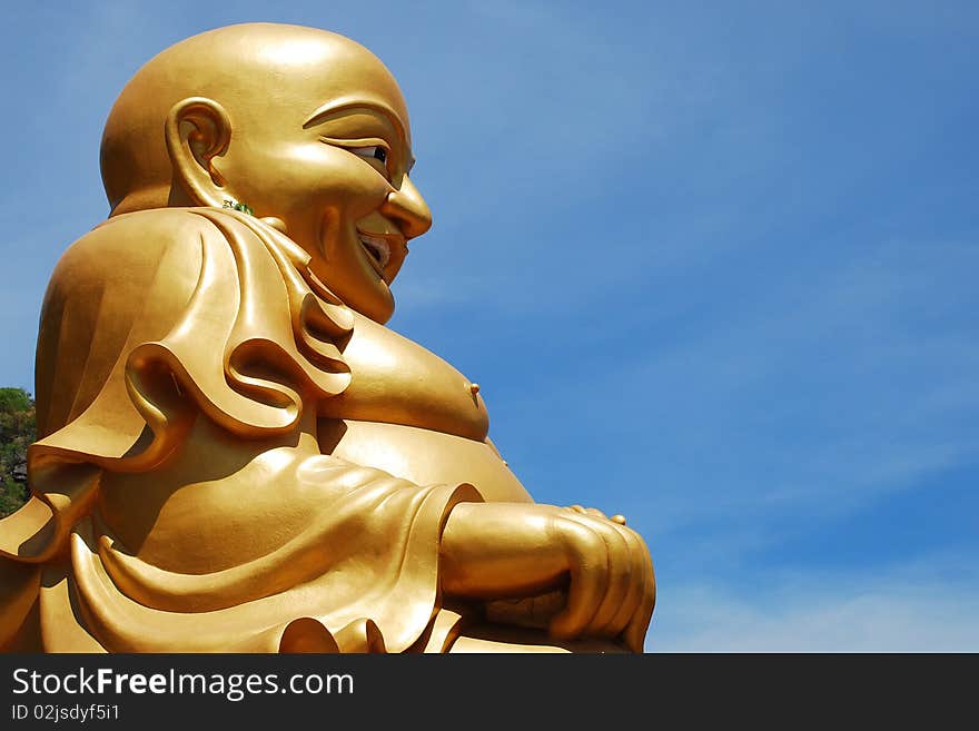 Big Buddha image and blue sky.