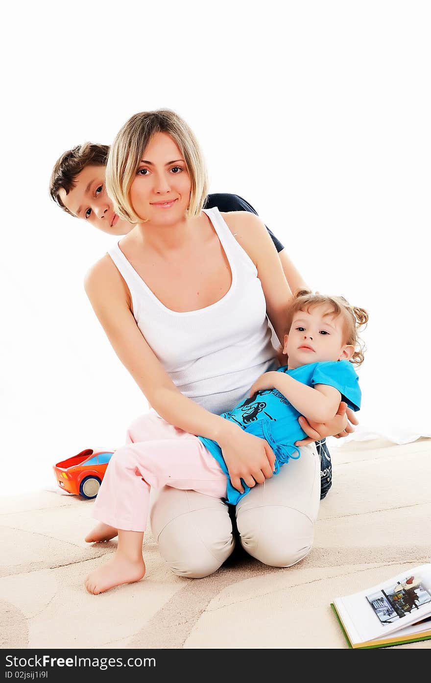 Young mother and her young daughter and son spend time together. Young mother and her young daughter and son spend time together